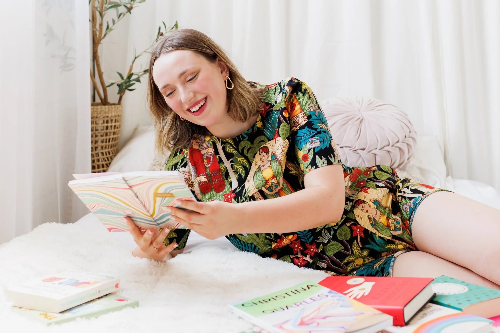 Claire Hueg reading, relaxed at home